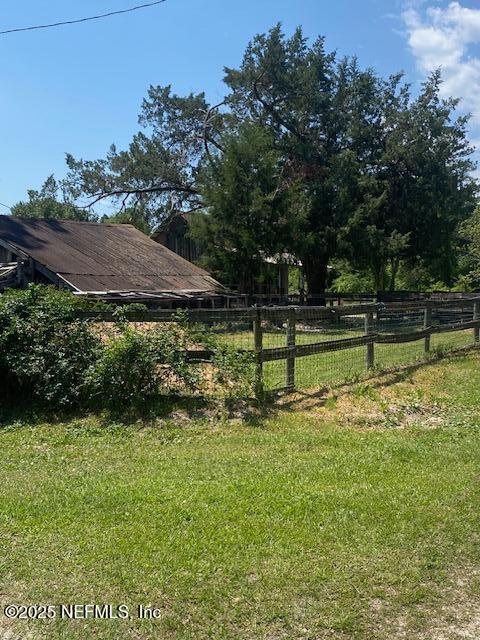 view of yard featuring fence