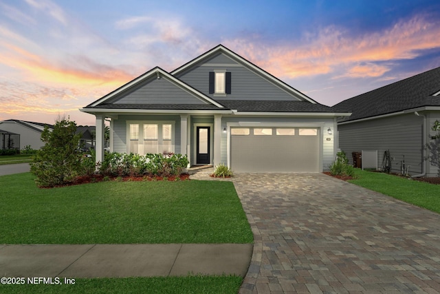 380 Maralinda Dr, Saint Augustine, FL 32095 - craftsman house with roof with shingles, driveway, a front yard, and a garage