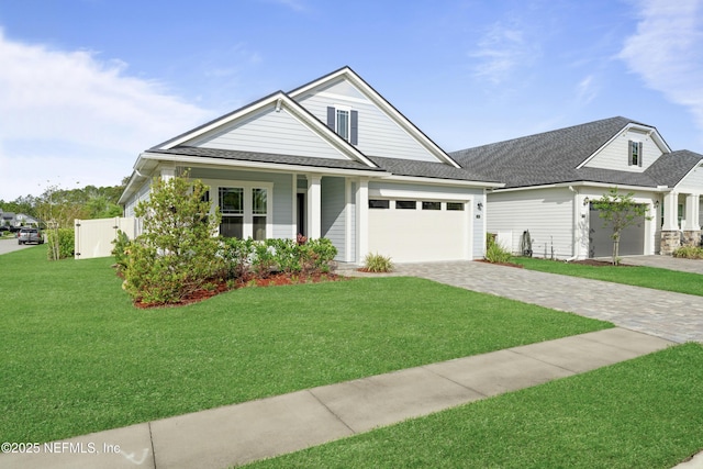 380 Maralinda Dr, Saint Augustine, FL 32095 - view of front of property with a garage, roof with shingles, decorative driveway, and a front lawn