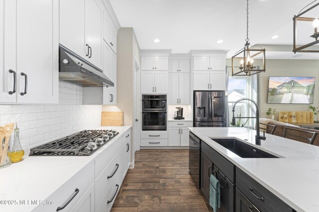 380 Maralinda Dr, Saint Augustine, FL 32095 - kitchen with gas cooktop, recessed lighting, under cabinet range hood, a sink, and stainless steel fridge