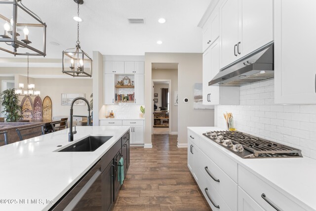 380 Maralinda Dr, Saint Augustine, FL 32095 - kitchen featuring visible vents, a sink, light countertops, a chandelier, and under cabinet range hood