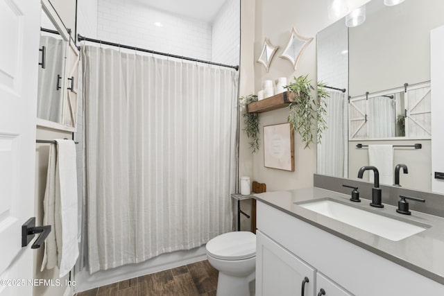 380 Maralinda Dr, Saint Augustine, FL 32095 - full bathroom featuring toilet, wood finished floors, vanity, and shower / bath combo with shower curtain