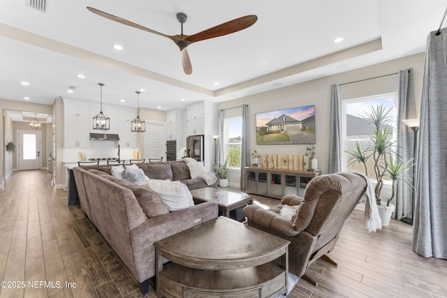 380 Maralinda Dr, Saint Augustine, FL 32095 - living room featuring dark wood-style flooring, visible vents, ceiling fan, and plenty of natural light