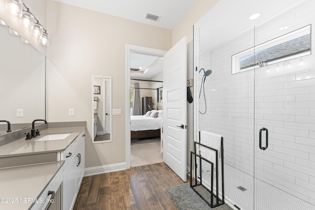 380 Maralinda Dr, Saint Augustine, FL 32095 - ensuite bathroom featuring ensuite bathroom, vanity, visible vents, wood finished floors, and a stall shower