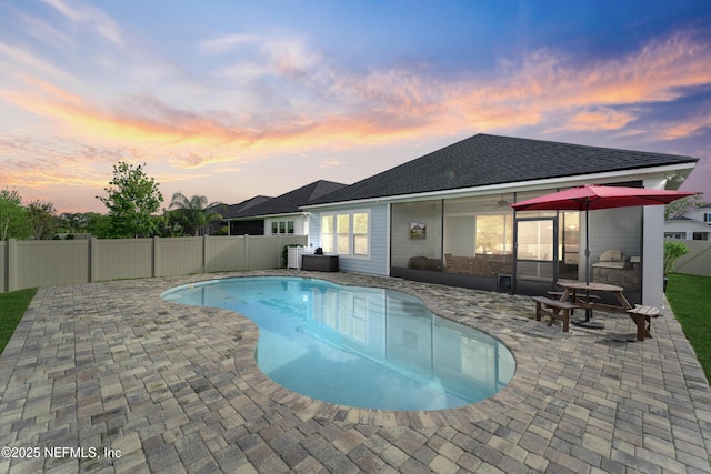 380 Maralinda Dr, Saint Augustine, FL 32095 - pool at dusk featuring a fenced in pool, a patio, and a fenced backyard