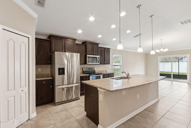 95210 Leafcrest Ct, Fernandina Beach, FL 32034 - kitchen featuring a sink, light tile patterned floors, stainless steel appliances, ornamental molding, and visible vents
