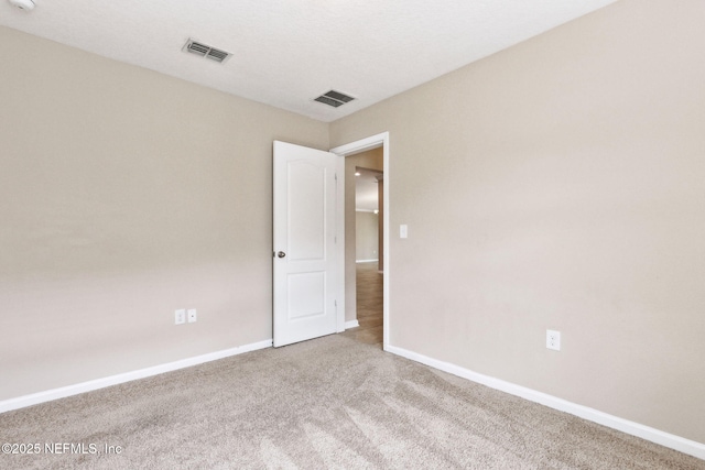 95210 Leafcrest Ct, Fernandina Beach, FL 32034 - empty room with visible vents, carpet flooring, and baseboards