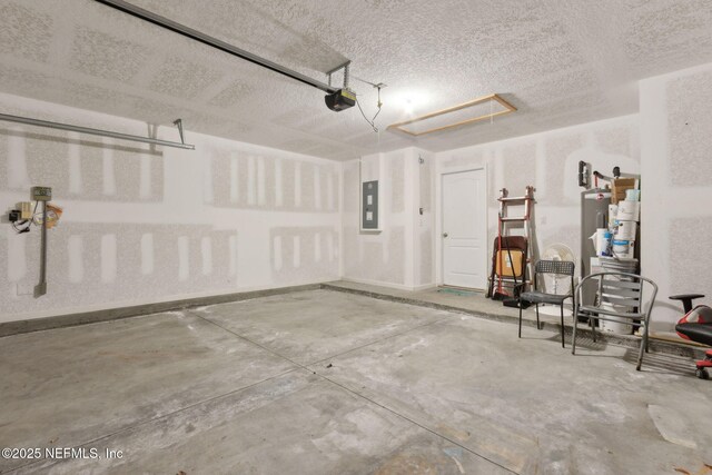 95210 Leafcrest Ct, Fernandina Beach, FL 32034 - garage featuring electric panel and a garage door opener