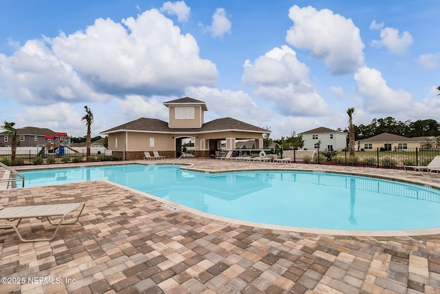 95210 Leafcrest Ct, Fernandina Beach, FL 32034 - community pool with a residential view, a patio area, and fence