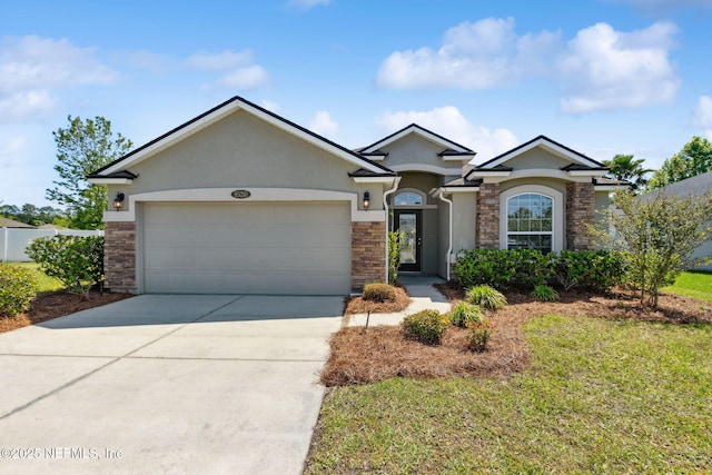 95210 Leafcrest Ct, Fernandina Beach, FL 32034 - single story home featuring concrete driveway, stone siding, an attached garage, a front yard, and stucco siding