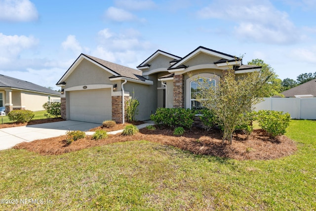 95210 Leafcrest Ct, Fernandina Beach, FL 32034 - single story home featuring concrete driveway, fence, a garage, a front yard, and stucco siding