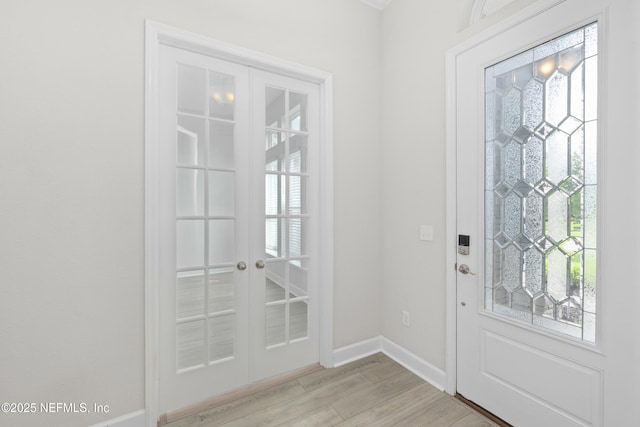 121 Oxford Estates Way, Saint Johns, FL 32259 - doorway with baseboards, french doors, and light wood-type flooring