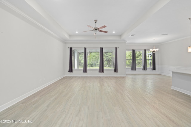 121 Oxford Estates Way, Saint Johns, FL 32259 - unfurnished living room with recessed lighting, light wood-type flooring, ceiling fan with notable chandelier, visible vents, and a raised ceiling