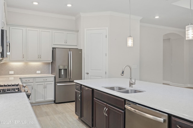 121 Oxford Estates Way, Saint Johns, FL 32259 - kitchen with white cabinetry, appliances with stainless steel finishes, light countertops, and a sink