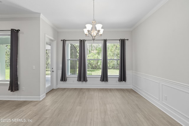 121 Oxford Estates Way, Saint Johns, FL 32259 - unfurnished dining area featuring ornamental molding, a chandelier, and light wood-style floors
