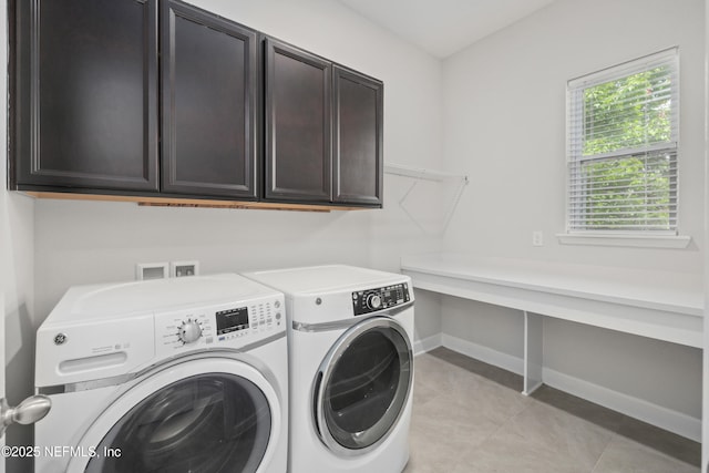 121 Oxford Estates Way, Saint Johns, FL 32259 - laundry room with light tile patterned floors, cabinet space, baseboards, and washer and clothes dryer