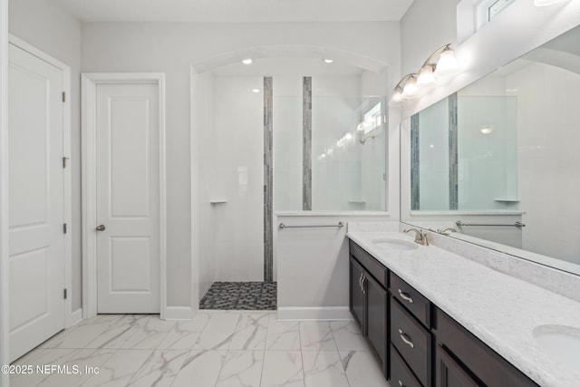 121 Oxford Estates Way, Saint Johns, FL 32259 - bathroom with double vanity, a sink, a walk in shower, and marble finish floor