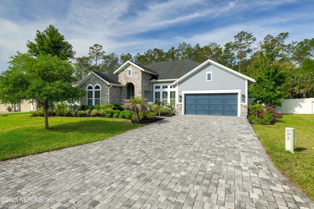 121 Oxford Estates Way, Saint Johns, FL 32259 - view of front of house with a front yard, fence, decorative driveway, and a garage