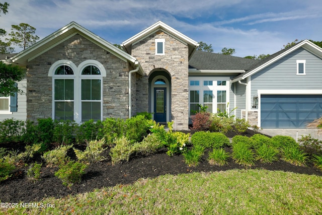 121 Oxford Estates Way, Saint Johns, FL 32259 - view of front facade with a garage, a front lawn, and stone siding
