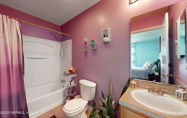 8413 Free Ave, Jacksonville, FL 32211 - bathroom featuring vanity, tile patterned floors, a textured ceiling, toilet, and shower / bathtub combination with curtain