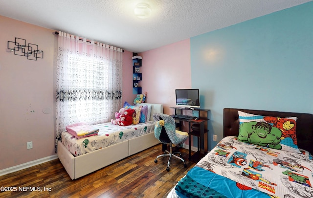 8413 Free Ave, Jacksonville, FL 32211 - bedroom featuring a textured ceiling, wood finished floors, and baseboards