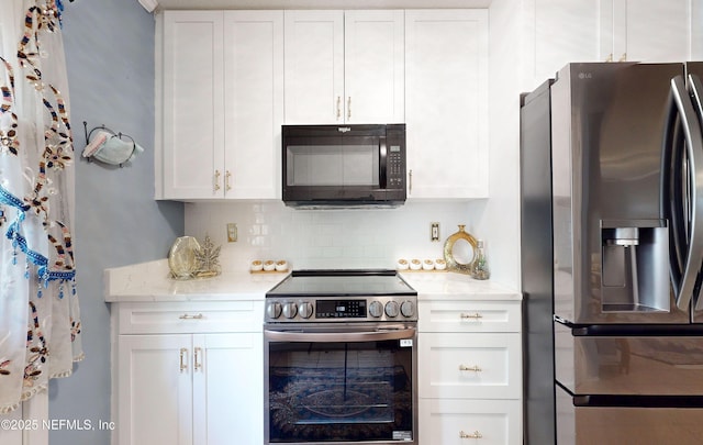 8413 Free Ave, Jacksonville, FL 32211 - kitchen featuring white cabinets, backsplash, light stone counters, and appliances with stainless steel finishes