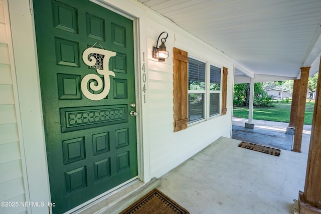 property entrance featuring covered porch