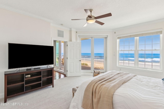 210 N Serenata Dr Unit 521, Ponte Vedra Beach, FL 32082 - carpeted bedroom with ceiling fan, visible vents, ornamental molding, a water view, and access to outside