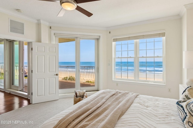 210 N Serenata Dr Unit 521, Ponte Vedra Beach, FL 32082 - bedroom with visible vents, access to exterior, ornamental molding, and multiple windows