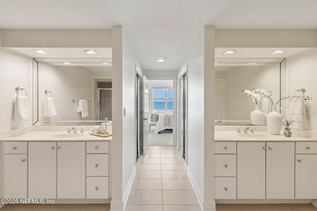 210 N Serenata Dr Unit 521, Ponte Vedra Beach, FL 32082 - ensuite bathroom with a sink, tile patterned flooring, ensuite bath, and two vanities