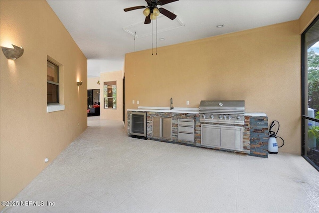 15 Dartmouth Trce, Ormond Beach, FL 32174 - view of patio / terrace featuring an outdoor kitchen, grilling area, a sink, a ceiling fan, and wine cooler