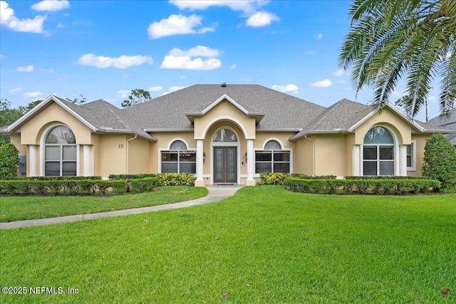 15 Dartmouth Trce, Ormond Beach, FL 32174 - single story home featuring a front lawn, french doors, and stucco siding