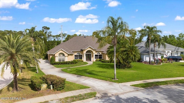 15 Dartmouth Trce, Ormond Beach, FL 32174 - view of front facade with a front lawn and stucco siding