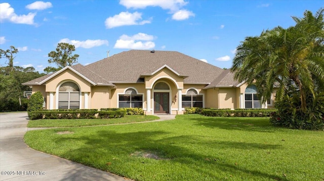 15 Dartmouth Trce, Ormond Beach, FL 32174 - view of front of property with stucco siding and a front lawn