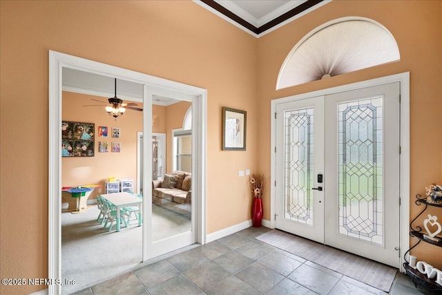 15 Dartmouth Trce, Ormond Beach, FL 32174 - entrance foyer with baseboards, a ceiling fan, french doors, and crown molding