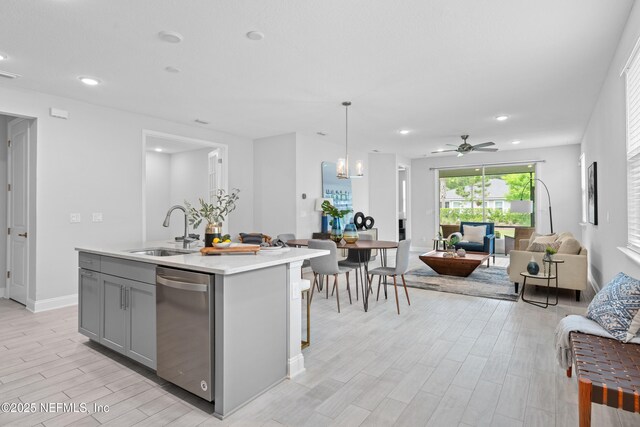 130 Juniper Hills Dr, Saint Johns, FL 32259 - kitchen featuring a sink, dishwasher, gray cabinets, open floor plan, and ceiling fan