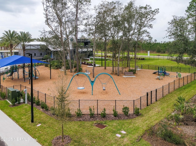 view of property's community featuring fence and a yard