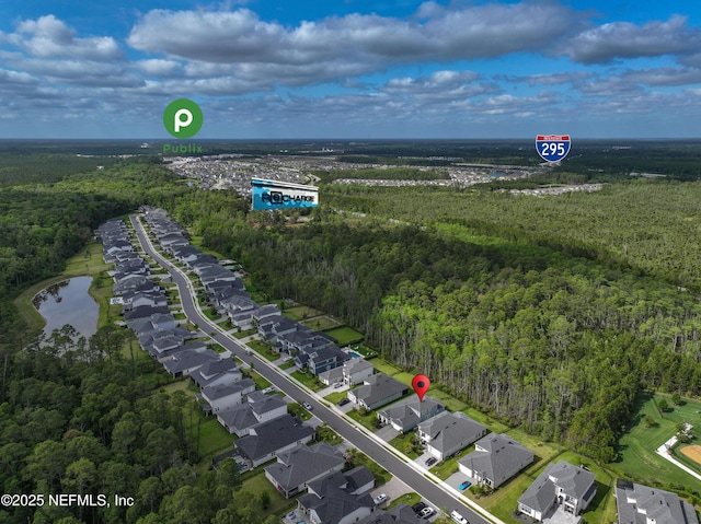 aerial view featuring a residential view, a water view, and a forest view