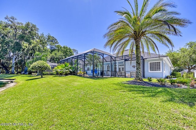 view of yard with a lanai