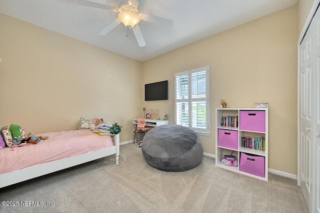 bedroom featuring ceiling fan, baseboards, carpet flooring, and a closet