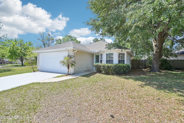 2734 Indigo Hills Ct, Jacksonville, FL 32221 - ranch-style house with a front lawn, concrete driveway, fence, a garage, and stucco siding