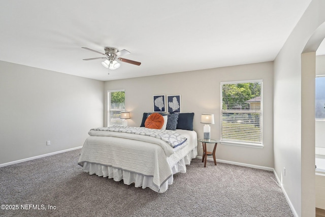 2734 Indigo Hills Ct, Jacksonville, FL 32221 - bedroom with arched walkways, carpet floors, a ceiling fan, and baseboards