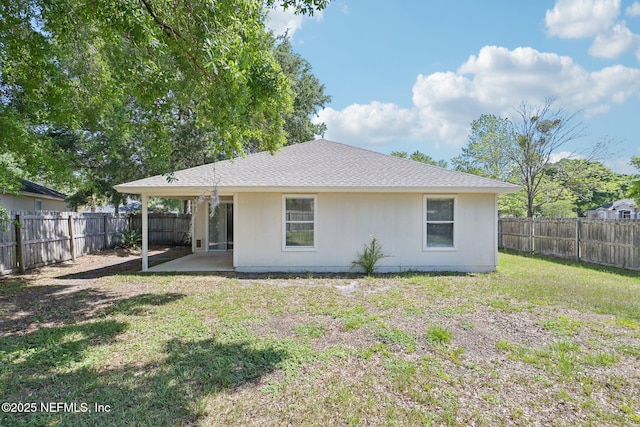 2734 Indigo Hills Ct, Jacksonville, FL 32221 - back of house featuring a patio area, a lawn, a shingled roof, and a fenced backyard
