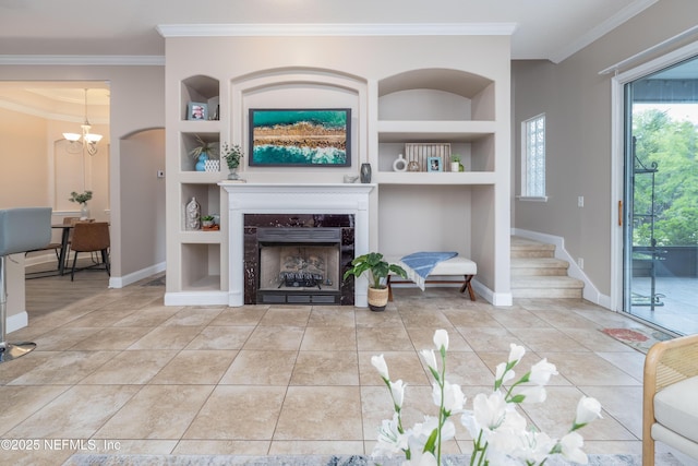 120 Oakwood Plantation Dr, Fleming Island, FL 32003 - living area with tile patterned floors, built in shelves, baseboards, and ornamental molding