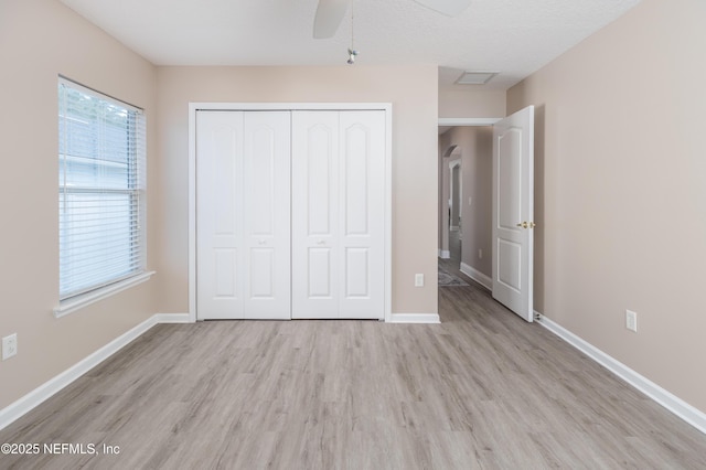120 Oakwood Plantation Dr, Fleming Island, FL 32003 - unfurnished bedroom with a closet, baseboards, a ceiling fan, visible vents, and light wood finished floors