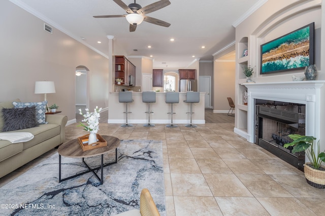 120 Oakwood Plantation Dr, Fleming Island, FL 32003 - living room with recessed lighting, crown molding, visible vents, ceiling fan, and built in shelves