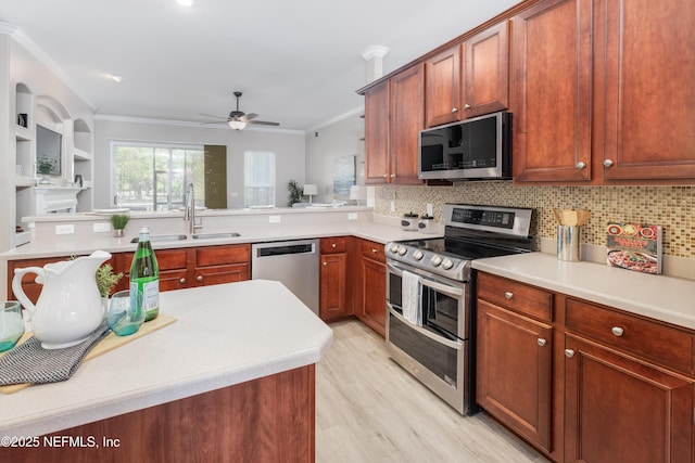120 Oakwood Plantation Dr, Fleming Island, FL 32003 - kitchen with a ceiling fan, decorative backsplash, ornamental molding, and stainless steel appliances