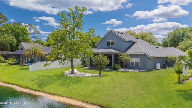 120 Oakwood Plantation Dr, Fleming Island, FL 32003 - rear view of property featuring central AC, a yard, fence, stucco siding, and roof with shingles