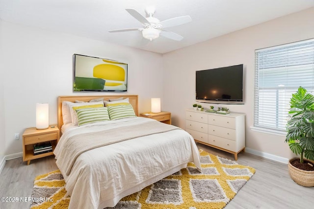 120 Oakwood Plantation Dr, Fleming Island, FL 32003 - bedroom featuring baseboards, a ceiling fan, and wood finished floors