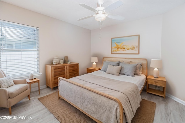 120 Oakwood Plantation Dr, Fleming Island, FL 32003 - bedroom with baseboards, a ceiling fan, and light wood-style floors